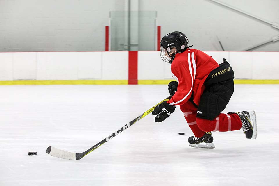 Hockey player practicing his shot