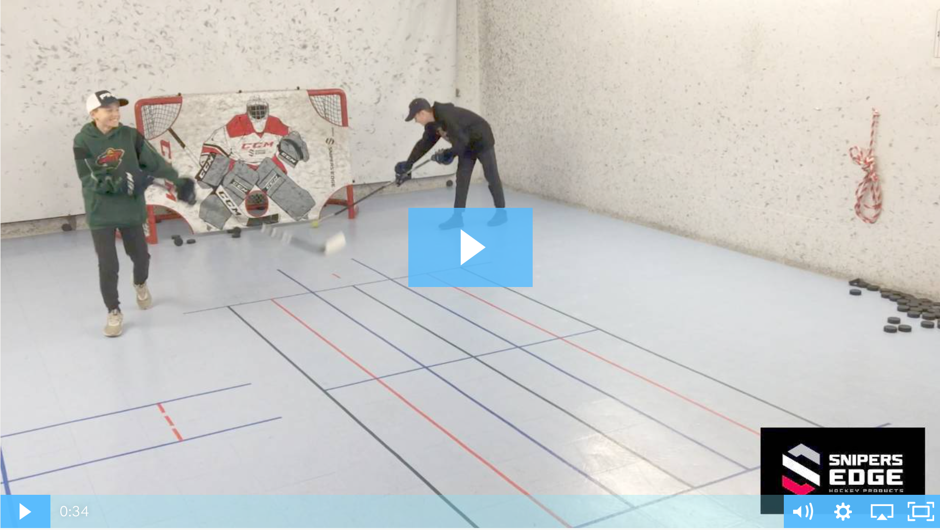 Youth hockey player working on how to hold a hockey stick