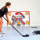 Girl shooting hockey puck on ice blue tiles