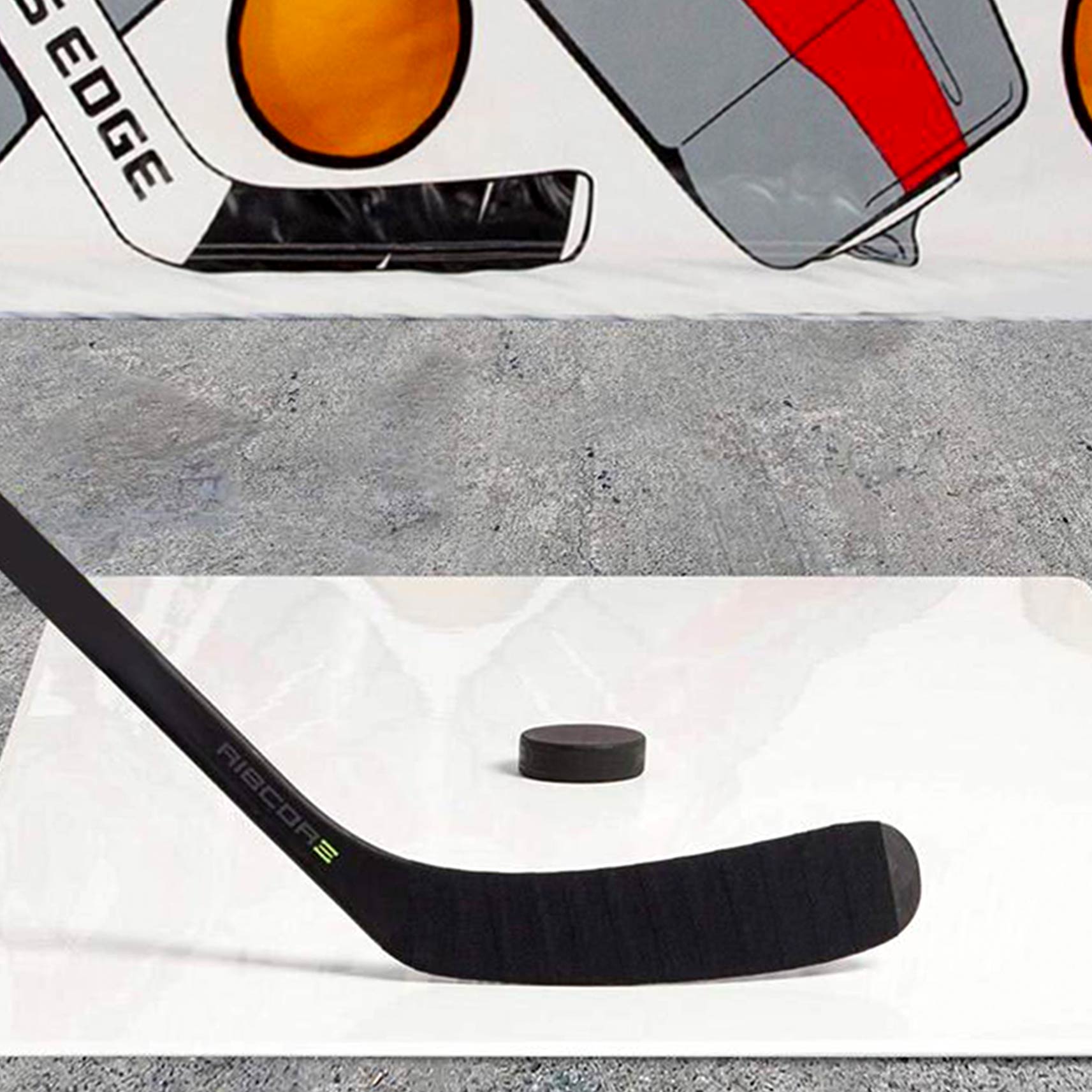 a puck and stick ready to shoot on a shooting pad