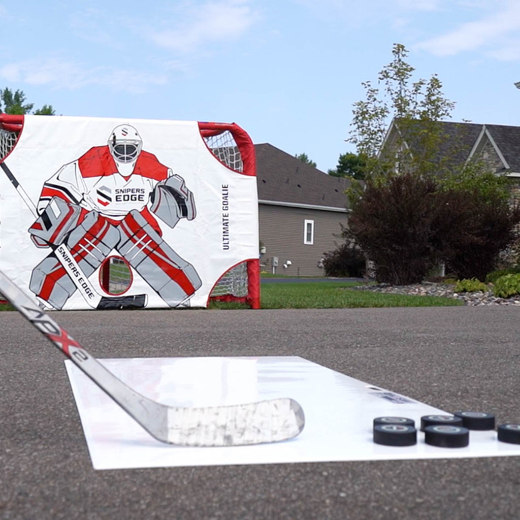 A Snipers Edge Shooting Pad in a driveway