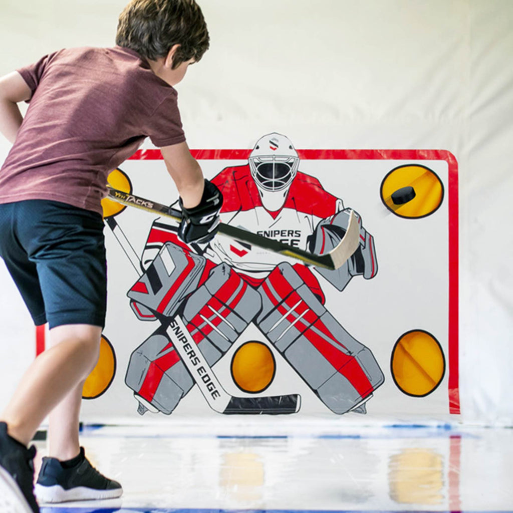 Young kid shooting on a shooting Tarp